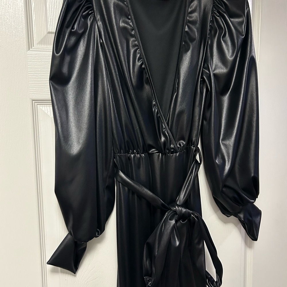 Sexy peek-a-boo deep v- neck Faux Leather Jumpsuit. Never worn.